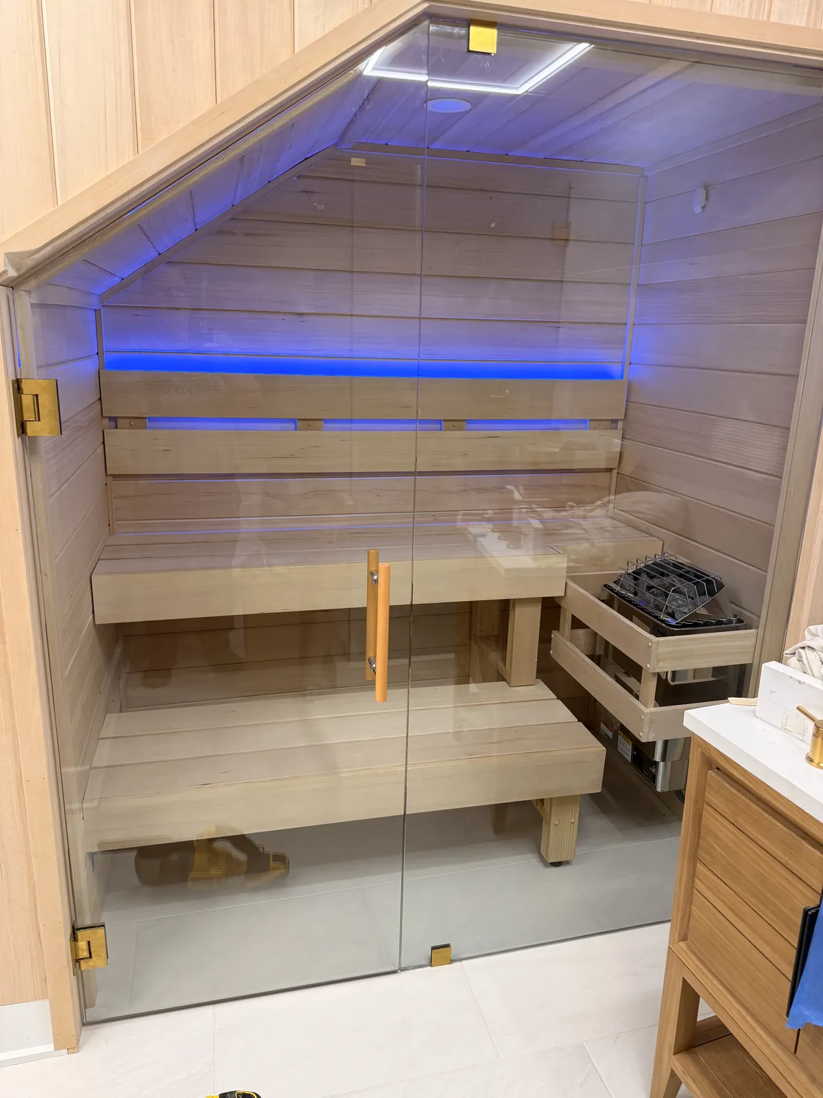 Custom glass-front sauna with LED lighting built by Saunas Plus in Metro Atlanta